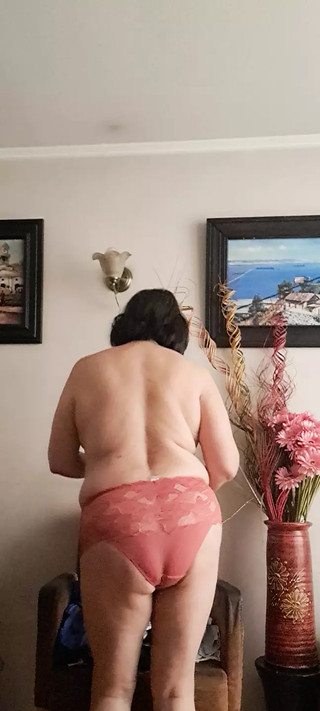 in underwear tidying up and the neighbor watching