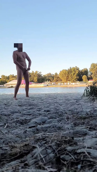 Dude pissing, jerking and cumming at nude beach. Got caught