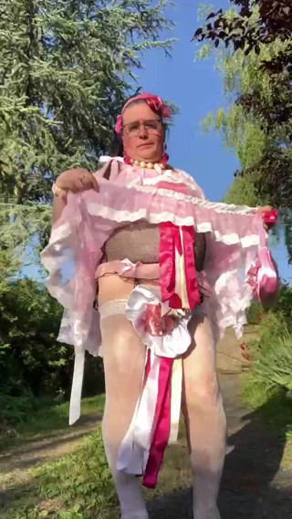 In an outfit with a pink nightgown and a white robe for an evening. thumbnail