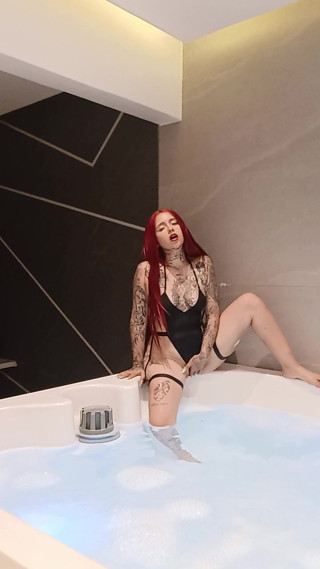 Redhead in jakuzzi alone