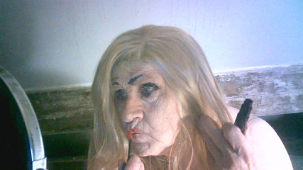 Ugly old sissy spunk bucket slag Sarah tries to make herself attractive to men by applying makeup to her ugly slag face thumbnail