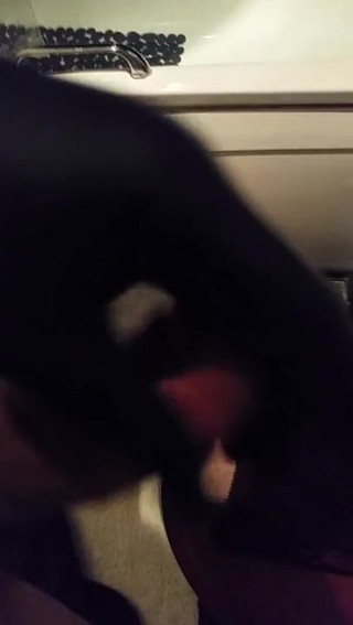 playing with black latex glove on