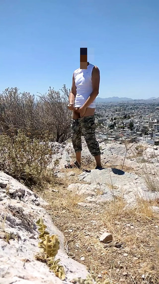 Sexy guy jerks on public place in Athens near Acropolis