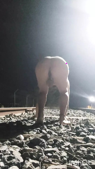 Naked and Pissing on the Train Tracks